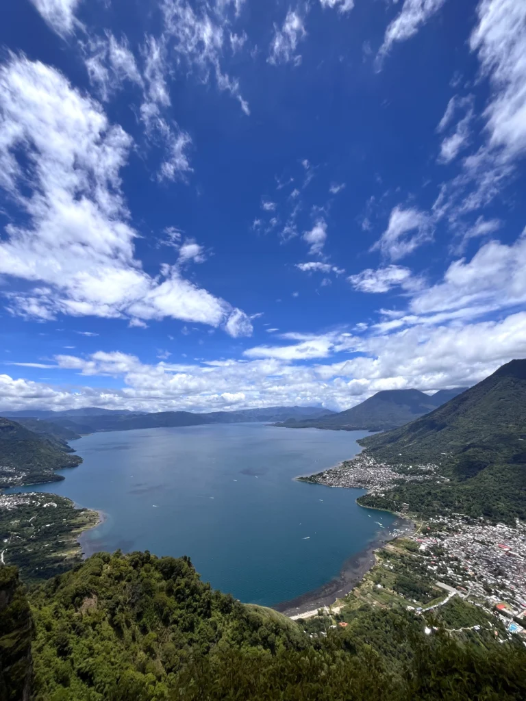 Lake Atitlán and a lakeside town seen from a high ridge above the water, Guatemala